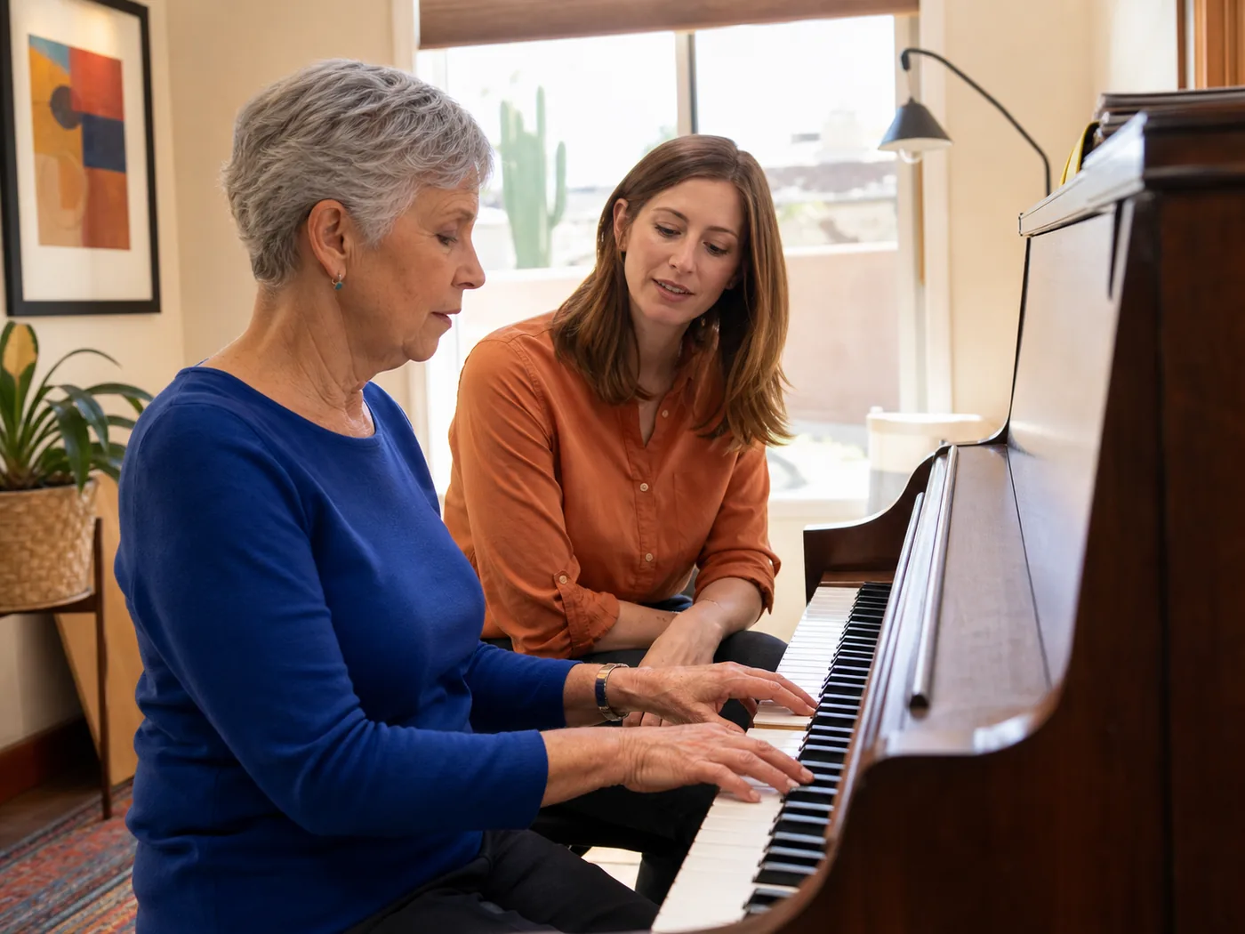 Older adult learning piano with an instructor during an illustrative home lesson